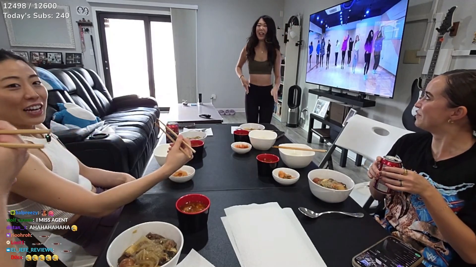 Maya holding on while Emily dances for everyone at Dinner