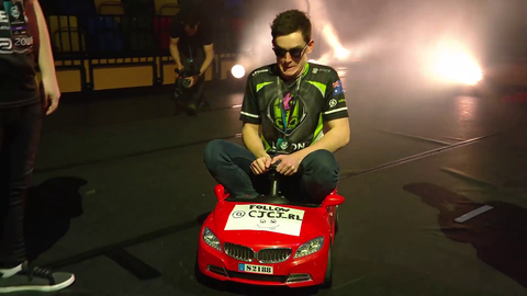 Rocket League pro drives a car onto stage