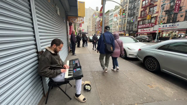 Low IQ, disgusting looking hobo plays a kid's piano in the middle of NYC, and gets laughed at, 2023 Colorized.