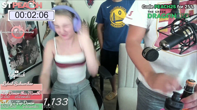 STPeach spills champagne over PC at the end of 24hour stream