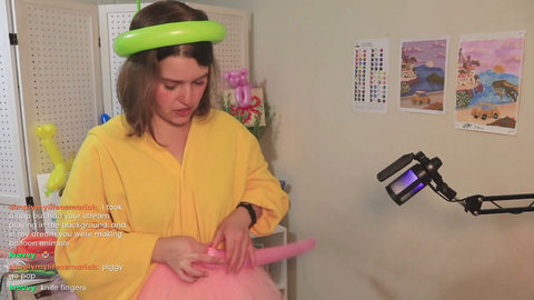Balloon artist completes a difficult twist, is impressed with herself
