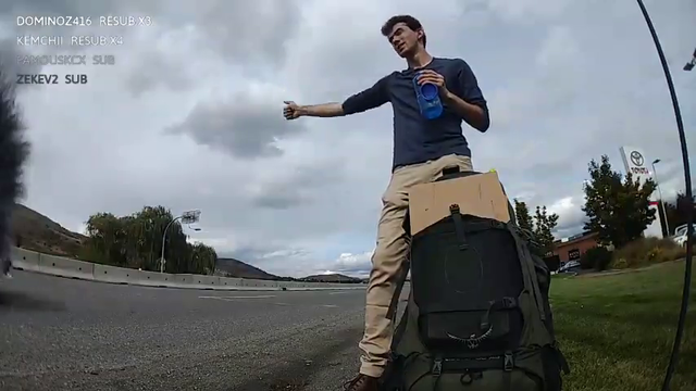 Crazy guy driving in reverse on the highway to pick up hitchhiker