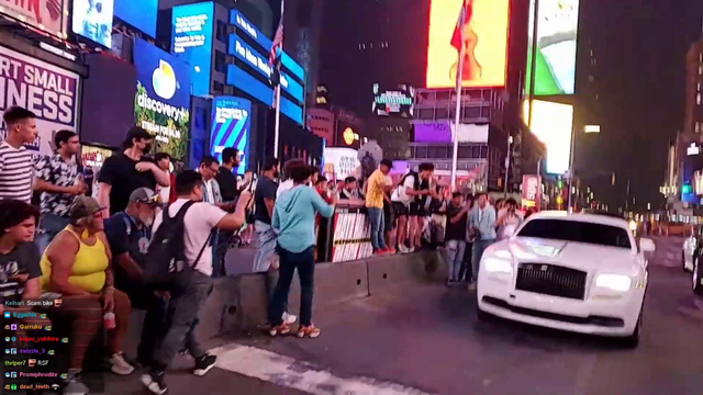 Jinny spots Travis Scott rolling through Times Square