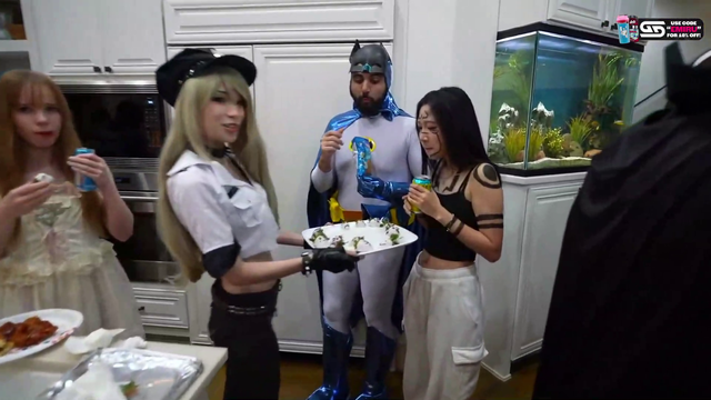 Emiru tries to feed Nat a strawberry