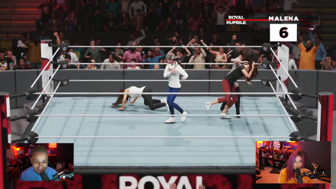 Malena watches herself enter the ring in a WWE Twitch Royal Rumble match