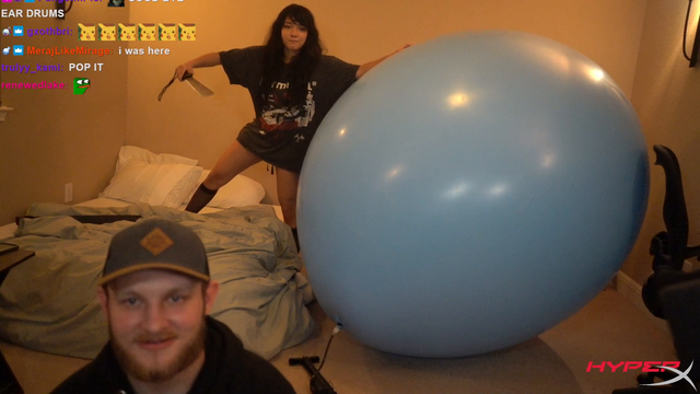 After 9 hours inflating balloon with bike pump, Cinna pops it with a machete