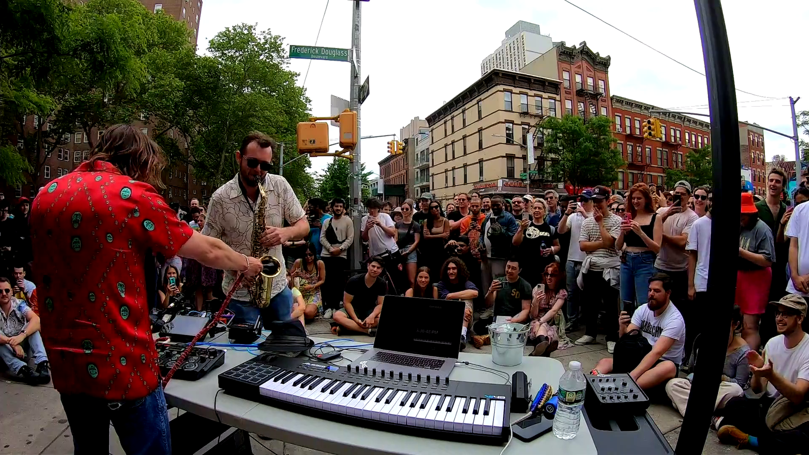 Saxophonist rips a solo on the streets of Harlem with Marc Rebillet