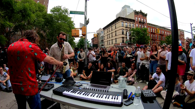 Saxophonist rips a solo on the streets of Harlem with Marc Rebillet