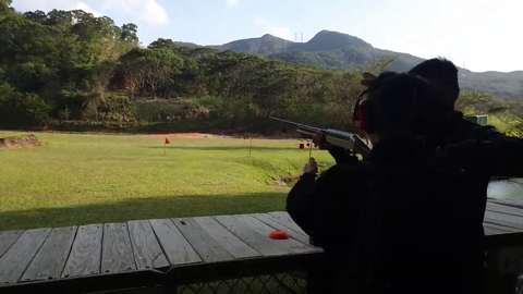 Jinny demonstrates her expertise with a shotgun against flying targets