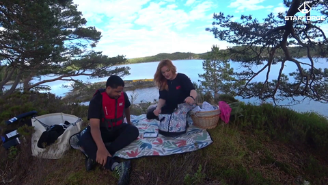 Nick and Malena picnic on a Norwegian Island