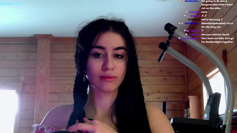 Malek_04 realizes she's braided her earbuds into her hair
