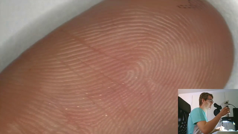 $4000 microscope on finger