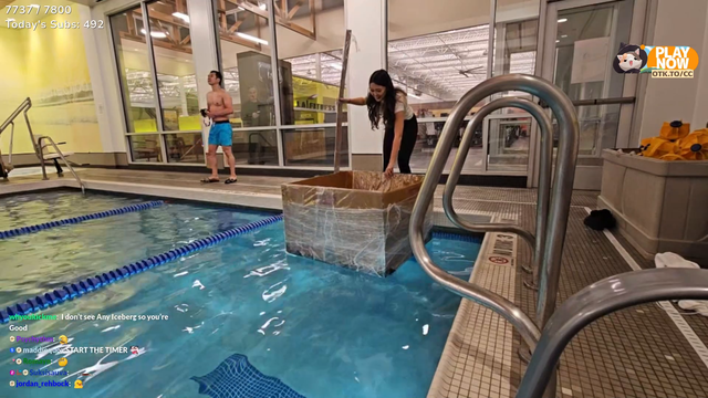 ExtraEmily christens her cardboard box boat in an LA Fitness's pool