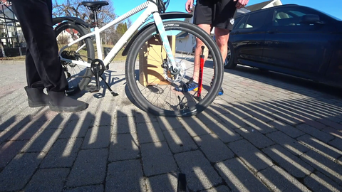 Knut failing to pump air into bicycle tires meanwhile daughter EZ Clap