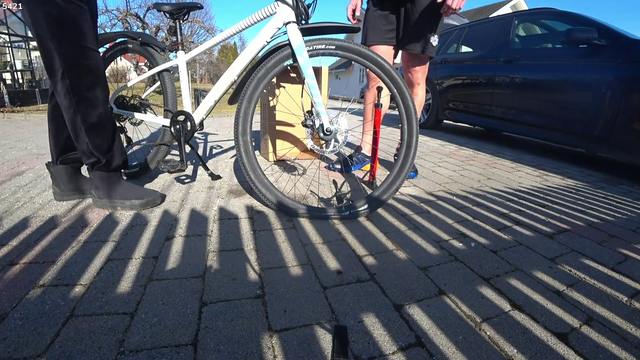 Knut failing to pump air into bicycle tires meanwhile daughter EZ Clap