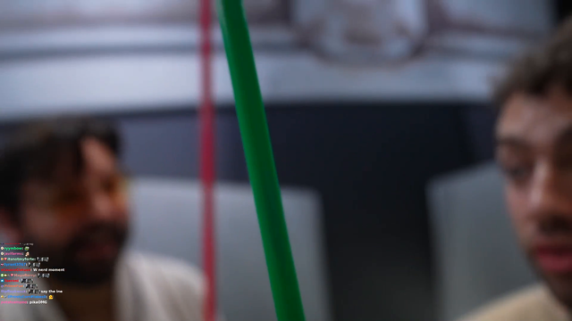 Cyr and Miz posing with the original Star Wars lightsabers