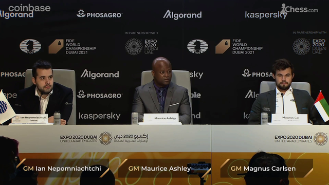 Andrea Botez asks Magnus Carlsen a question at the World Chess Championship press conference