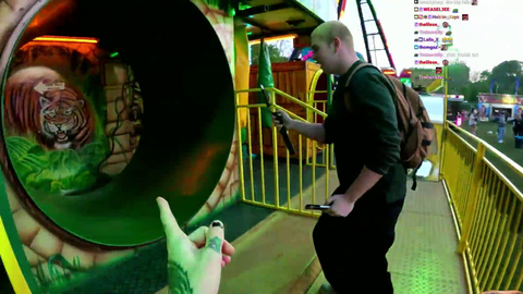 zoil tries to get on a carnival ride