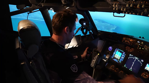 AustinShow looking at phone while flying a plane