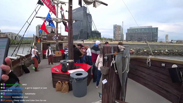 Drunk couple fall on the streamer while making out on a pirate party ship