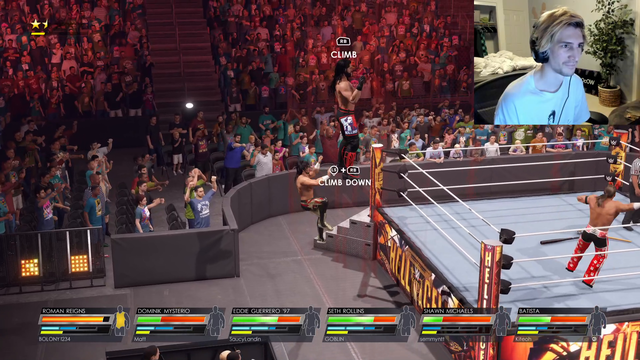 xQc climbs on top of the cage in WWE 2K22