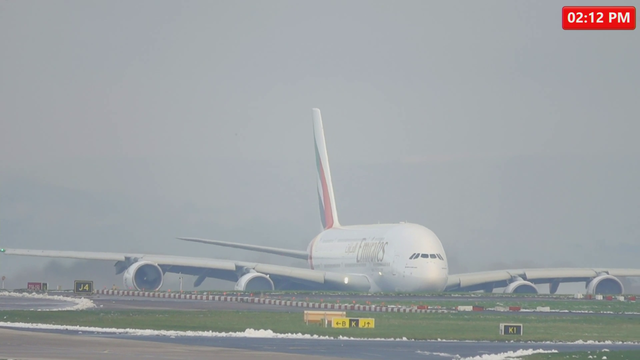 Beautiful snowy takeoff of an Emirates Airbus A380 roaring out of Manchester