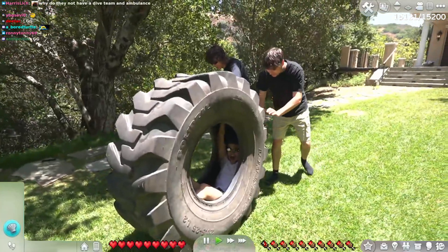 Jason rolls in a tire onto a pool