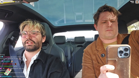 Phin looking at chat while driving