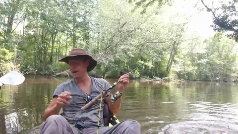 Alec has a bite on both of his rods while smoking a cig