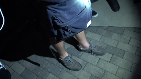 Bjorn reaches in his bag in front of cop