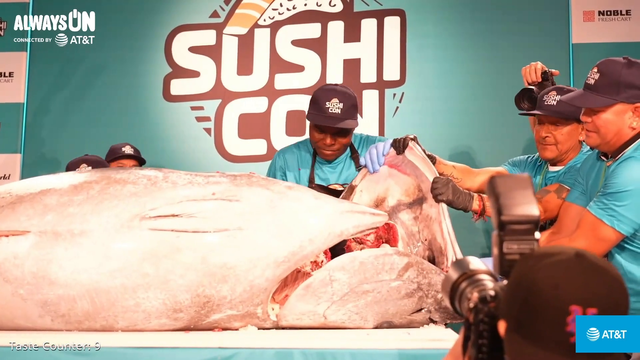 The two Emily's watch a Tuna Cutting Ceremony in Sushicon